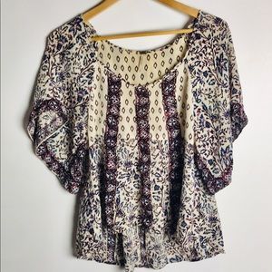 Free People-Hi Low Top In Size medium.